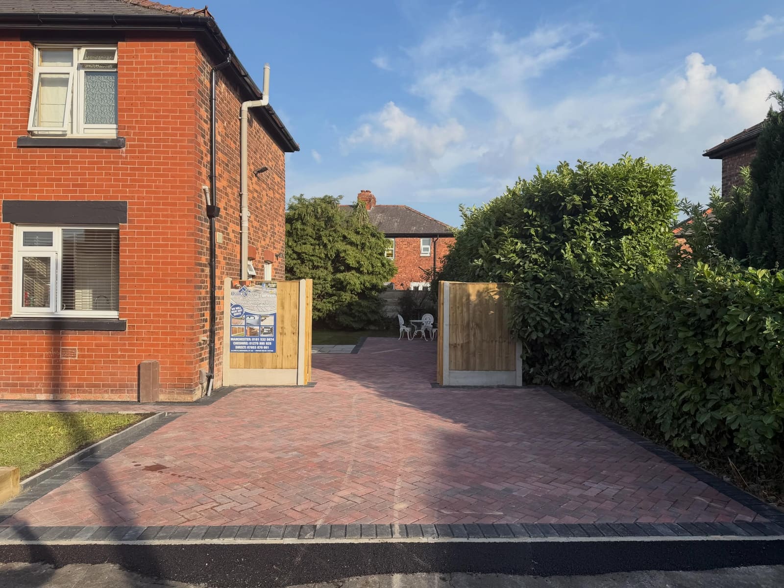 Herringbone block driveway through timber gates to rear patio Manchester