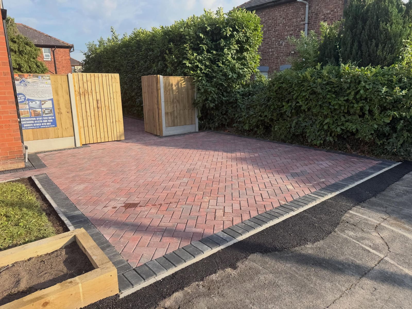 Red brindle herringbone block paving with charcoal double border edging