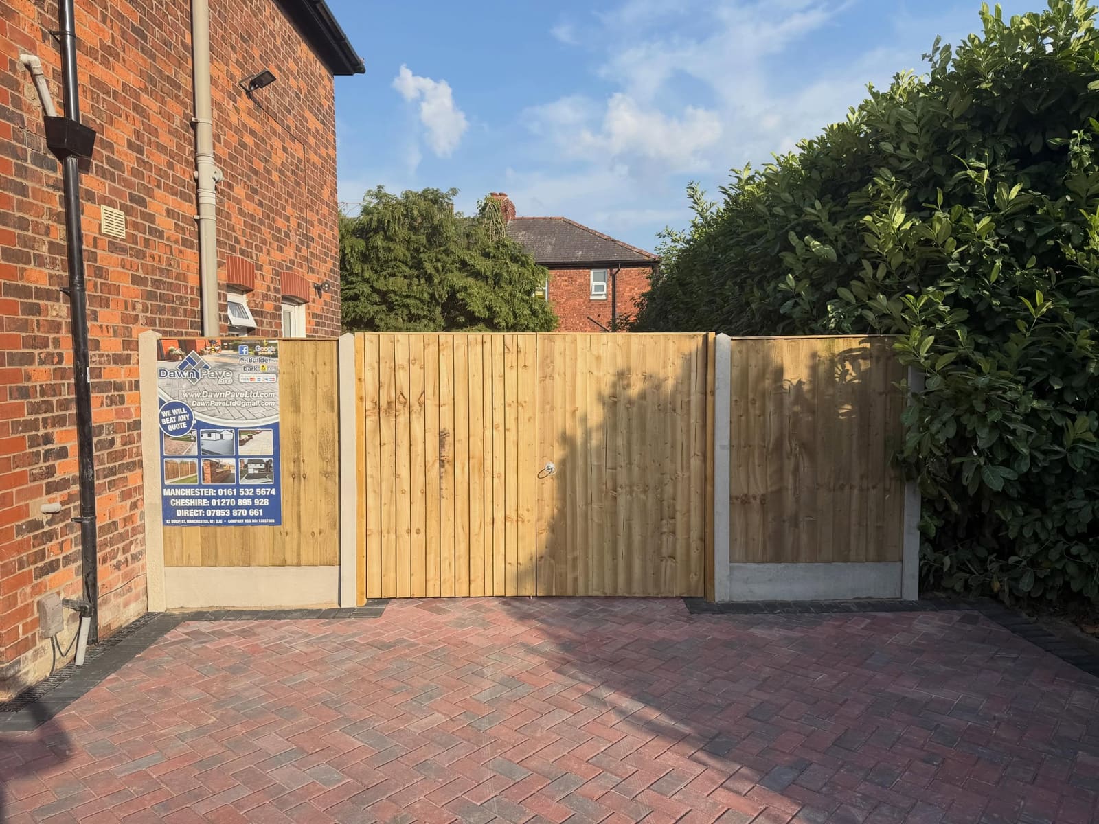 Timber closeboard gates and panels beside herringbone drive Manchester