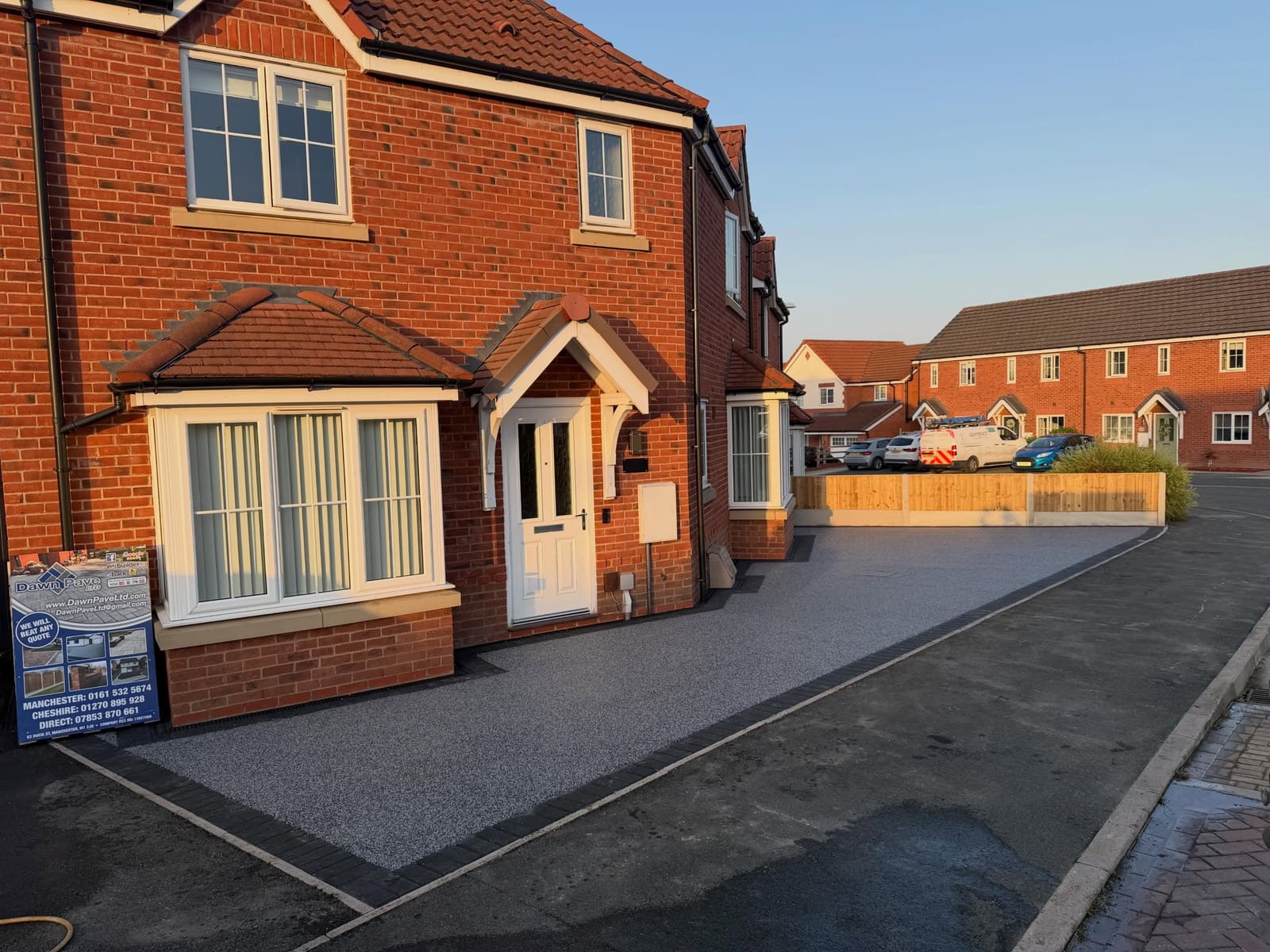 Silver grey resin bound driveway with charcoal block border Cheshire