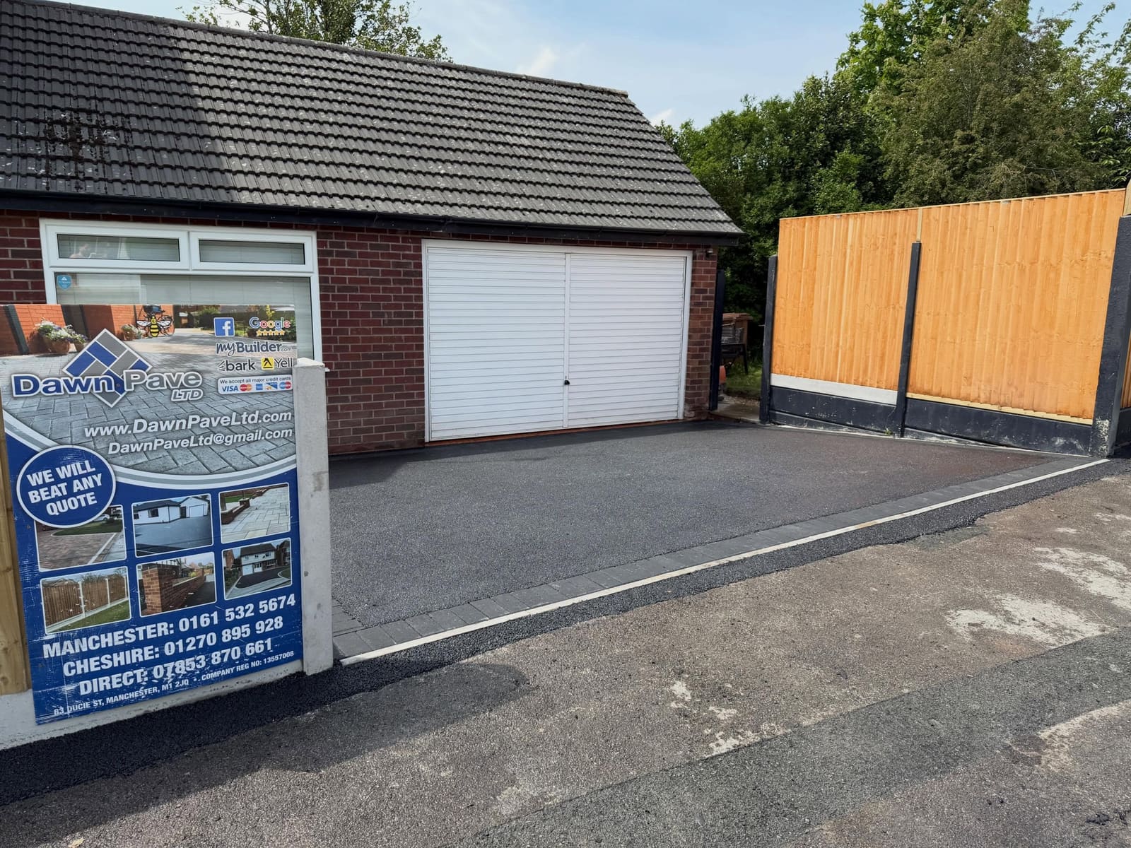 New tarmac drive to double garage with timber fence panels Manchester